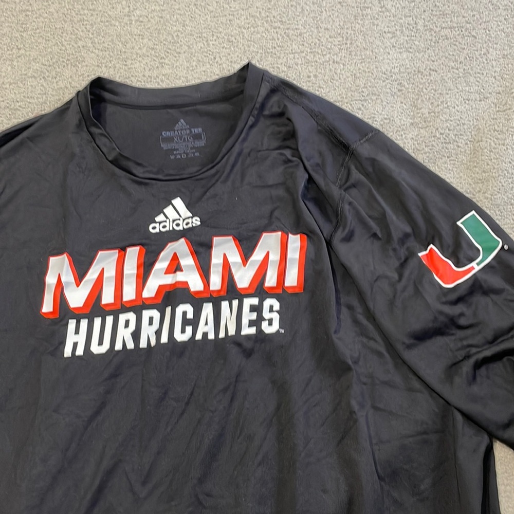Long sleeve Adidas University of Miami Hurricanes shirt with U logo on sleeve
